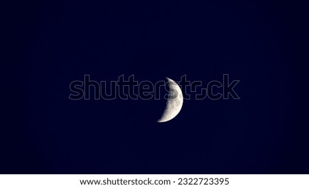 Waxing moon and artificial satellite rotates moon, the concept of studying and landing man on moon, flight to moon