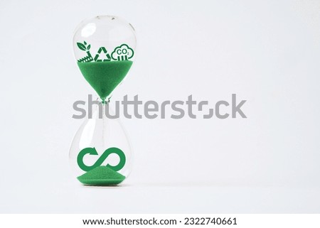 Infinity symbol with Circular business economy environment icons inside hourglass  for future sustainable investment growth and reduce environmental pollution concept.