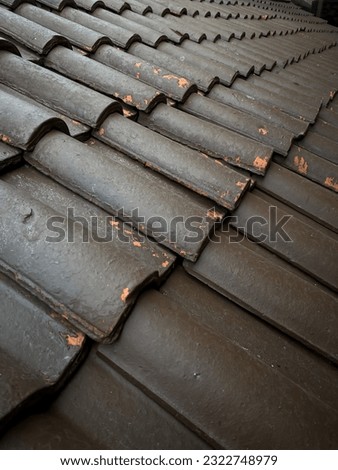 the roof of a building that is neatly arranged in the shape of a tile in order to provide protection from rain and sun.