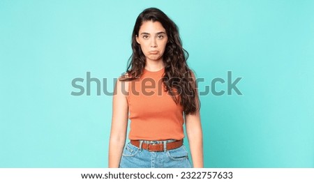 young pretty woman feeling sad and whiney with an unhappy look, crying with a negative and frustrated attitude Royalty-Free Stock Photo #2322757633