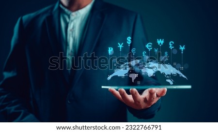 Global business and Global currency exchange concept, money, finance, Businessman holding tablet with virtual world map and connection line effect, dollar yuan yen euro and pound sterling sign.  Royalty-Free Stock Photo #2322766791