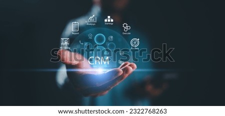 Businessman show CRM Customer Relationship Management for business sales marketing system concept presented in futuristic graphic interface of service application to support CRM database analysis. Royalty-Free Stock Photo #2322768263