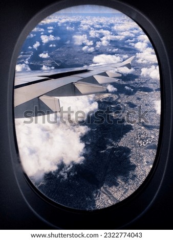 Vintage filter edited picture of airplane’s wing out the window.