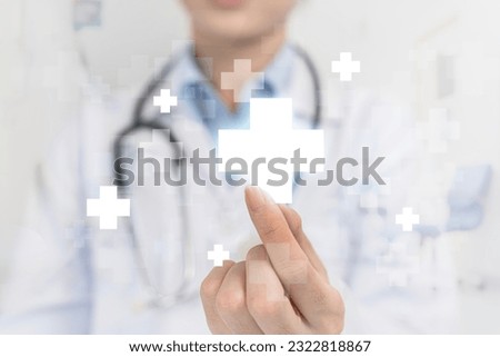 Healthcare and medical background. Doctor, surgeon, holding medical cross symbol. Concept of health care and insurance. Female doctor holding white cross in hand