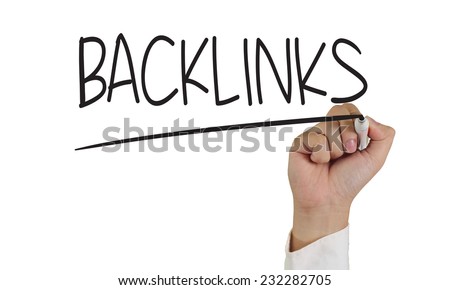 Image of a hand holding marker and write backlinks word isolated on white