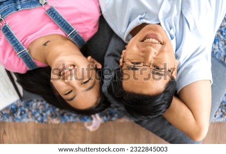 Portrait of enjoy happy love asian family mature father and little girl daughter smiling play laughing and having fun together.happy family and father's Day in moments good time at home
