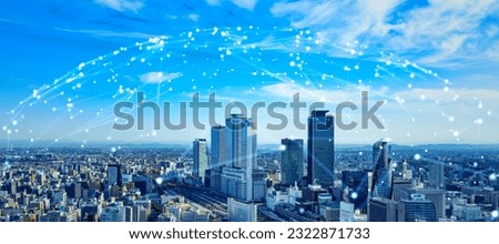 Modern cityscape and communication network concept. Telecommunication. IoT (Internet of Things). 5G. Smart city. Digital transformation. Composite visual with a drone point of view. Mixed media. Royalty-Free Stock Photo #2322871733