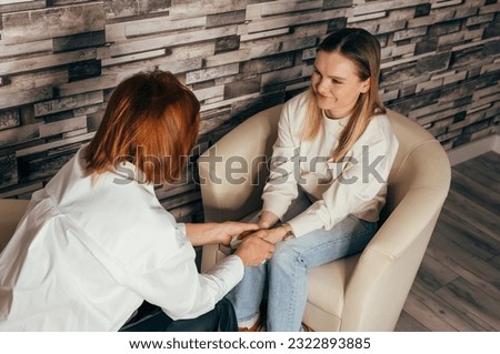 Female patient having consultation with counsellor. Psychologist comforting his patient. Woman psychologist talking to patient. Psychologist consulting and psychological therapy session concept. Royalty-Free Stock Photo #2322893885