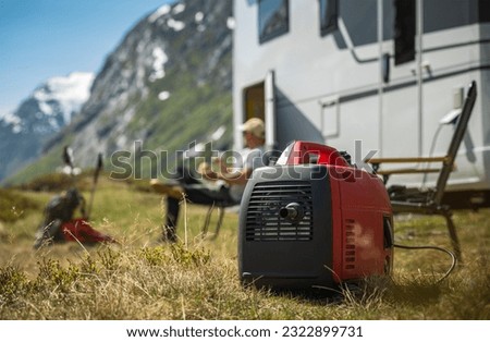 Using Portable Gasoline Inverted Generator While Dry Camping in a Camper Van.  Royalty-Free Stock Photo #2322899731