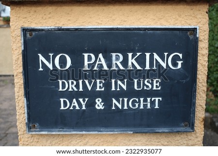 Road sign "No Parking Drive in use day and night"