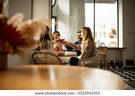 Cheers. Birthday celebration. Joyful friends having fun together at cafe, congratulating. Drinking wine, eating tasty desserts. Concept of party, celebration, taste, alcohol. Copy space for ad