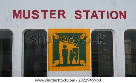 Sign Muster Station on a ferry, is a gathering place in an emergency
