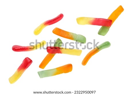 Colored jelly worms flying close-up on a white background. Isolated