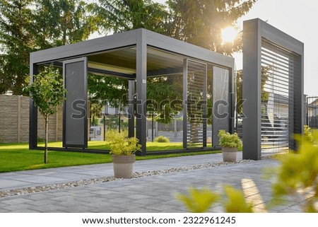 Modern BAT R Bioclimatic Aluminum Pergolas. Experience luxury outdoors with BAT R Bioclimatic Pergolas. Stylish, durable, and customizable – perfect for premium gardens and terraces. Royalty-Free Stock Photo #2322961245