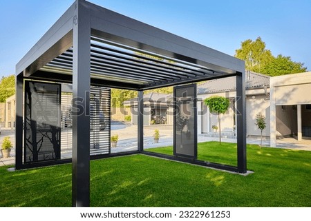 Modern BAT R Bioclimatic Aluminum Pergolas. Experience luxury outdoors with BAT R Bioclimatic Pergolas. Stylish, durable, and customizable – perfect for premium gardens and terraces. Royalty-Free Stock Photo #2322961253