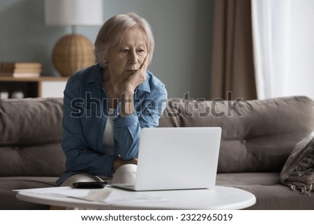 Old stressed woman manage family finances feels desperate due to huge debts, unpaid bills, budget overspend, subpoena received, lack of money to pay monthly utility bills. Financial crisis, bankruptcy Royalty-Free Stock Photo #2322965019