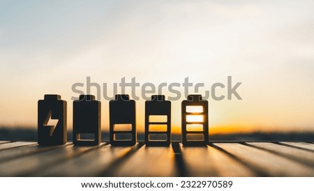 Battery charge indicator wood model. Phone charge level. Concepts of battery charge indicators through mesmerizing photographs. Unleash the power, technology, and innovation of these digital icons. Royalty-Free Stock Photo #2322970589