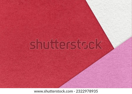 Texture of craft red color paper background with white and lilac border. Vintage abstract wine cardboard. Presentation template and mockup with copy space. Felt viva magenta backdrop closeup. Royalty-Free Stock Photo #2322978935