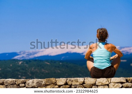 Tourist woman enjoying mountain view in Provence France. Mount Ventoux on horizon.