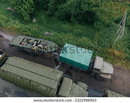 Pontoon bridge of the Ukrainian army. Installation of a temporary crossing near the destroyed bridge. Soldiers collect pontoon ferry. Top view from a drone. Nikopol, UKRAINE – May 26, 2020 Royalty-Free Stock Photo #2322988963