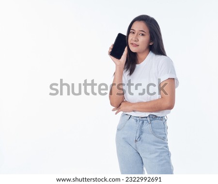 Woman showing smartphone with blank screen on white background. Space for text