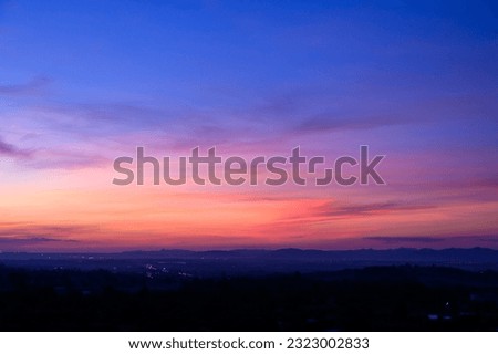 Evening time of panorama mountain under dramatic twilight sky and cloud. Nightfall Silhouette mountain on sunset Royalty-Free Stock Photo #2323002833