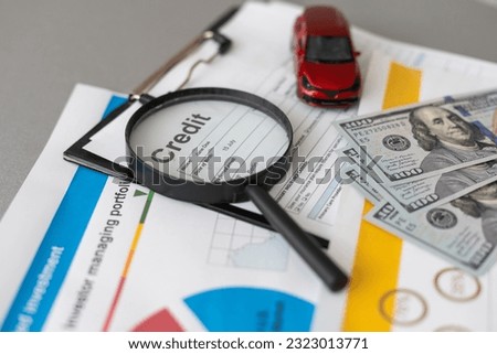 Personal loan application form excellent credit score with calculator, dollar money, and pen Royalty-Free Stock Photo #2323013771