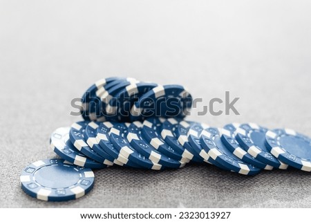This eye catching image of two miniature businessmen shaking hands could be used for the stock market, banking, real estate and wealth management. The blue chips represent a solid investment.