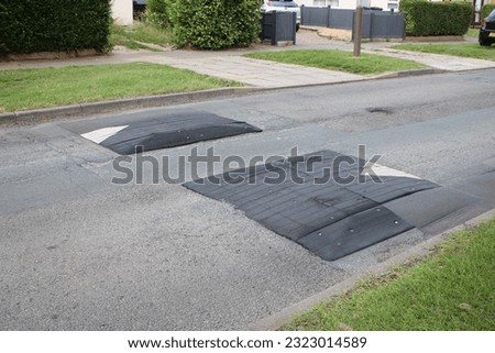 Speed bumps on a residential road Royalty-Free Stock Photo #2323014589