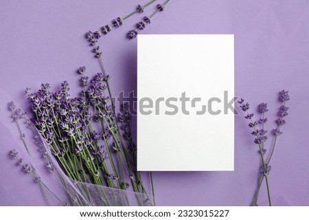 Blank wedding invitation card mockup with fresh lavender flowers