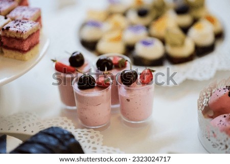 Fruit mousse in a transparent cup. Ideas for serving. Picture for a menu or confectionery catalog, restaurant, candy bar