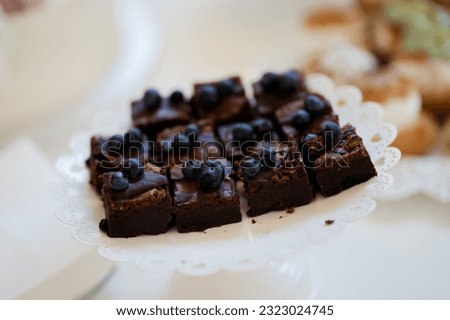 Chocolate brownie. Ideas for serving. Picture for a menu or confectionery catalog, restaurant, candy bar