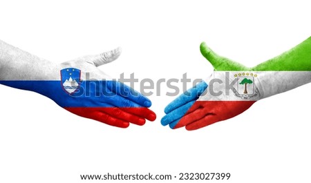 Handshake between Equatorial Guinea and Slovenia flags painted on hands, isolated transparent image.