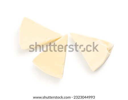 Triangles of tasty processed cheese on white background Royalty-Free Stock Photo #2323044993