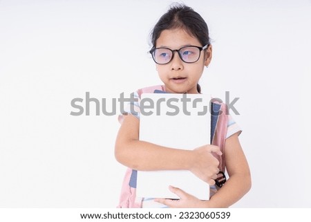 Asia kids girl wearing glasses with a pink backpacks learn at school isolated on white background with copy space. Concepts back to school, learning, education.