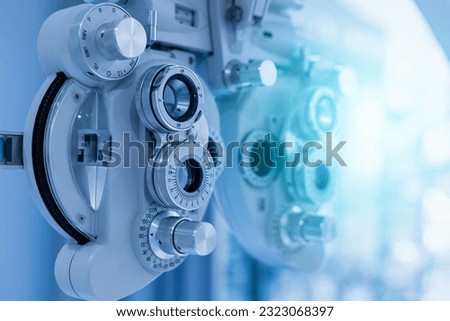 Phoropter eyesight measurement testing machine, Eye health check and ophthalmology concept. Web banner size. Copy space. Royalty-Free Stock Photo #2323068397
