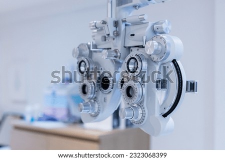 Phoropter eyesight measurement testing machine, Eye health check and ophthalmology concept. Web banner size. Copy space. Royalty-Free Stock Photo #2323068399