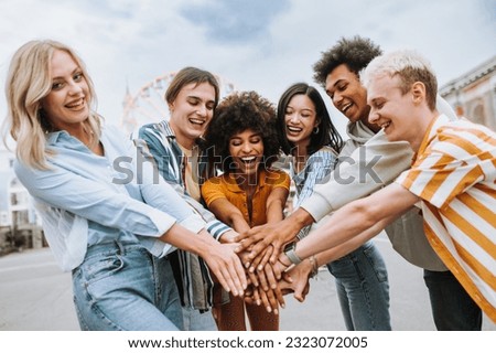 Multiracial young people together meeting and social gathering - Group of friends with mixed races having fun outdoors in the city- Friendship and lifestyle concepts Royalty-Free Stock Photo #2323072005