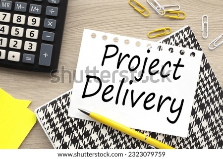 PROJECT DELIVERY open notepad near stickers. yellow pen. text on torn paper