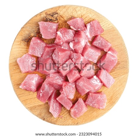 Sliced fresh meat on wooden board