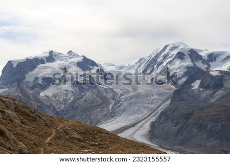 Panorama view with mountain Dufourspitze (left), Gorner Glacier and mountain Lyskamm (right) in mountain massif Monte Rosa in Pennine Alps, Switzerland Royalty-Free Stock Photo #2323155557