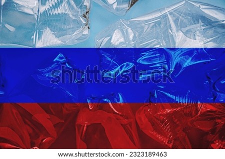 Russia flag is shown on the plastic bottles. Ecology concept with environmental pollution from household and industrial waste. Concept of stopping plastic pollution. Ban disposable products.