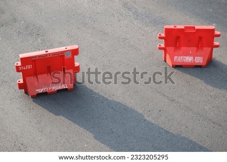 Road Block or Road Barriers With Their Shadow in the morning
