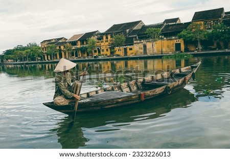 Hoi An is a small town which is situated on the bank of Thu Bon river located in central Vietnam. There is no airport, and no train station either, that's why the only way to get to Hoi An is by road. Royalty-Free Stock Photo #2323226013
