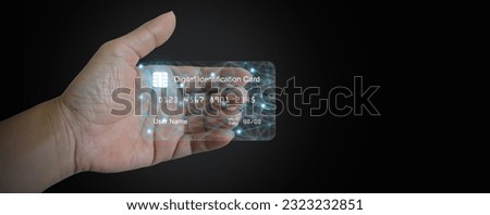 Digital ID card, Electronic Identification. e-ID smartcard, on a man's hand. A digital solution for proof of identity. Technology and business Royalty-Free Stock Photo #2323232851