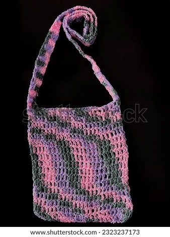 net noken bag with a combination of pink gray and purple