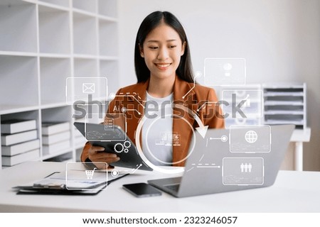 close up of businesswoman working with laptop computer and smart phone on desk in office with virtual icon diagram 
