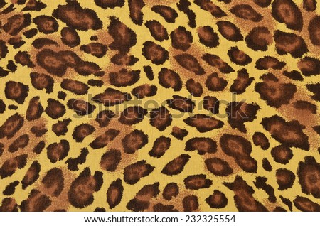 Brown leopard pattern. Spotted animal print as background.