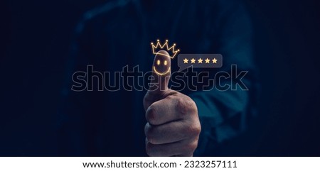 Customer service satisfaction concept. Hand with thumb up Positive emotion smiley face icon and five star with copy space. Satisfied, feedback, review, good, best, good product and service, quality Royalty-Free Stock Photo #2323257111