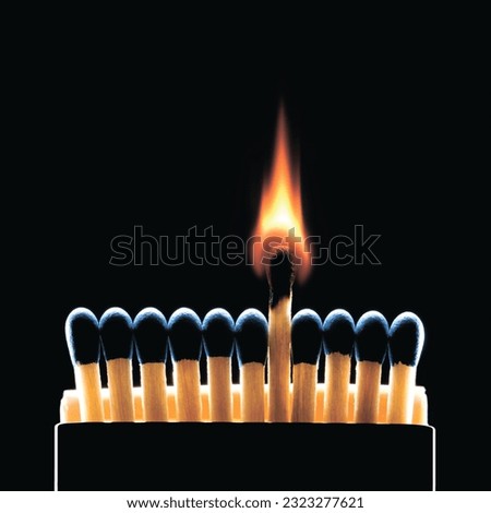 Matchstick flames, ignite spark, lit, flammable, hot, burn, hot, on the black background Royalty-Free Stock Photo #2323277621